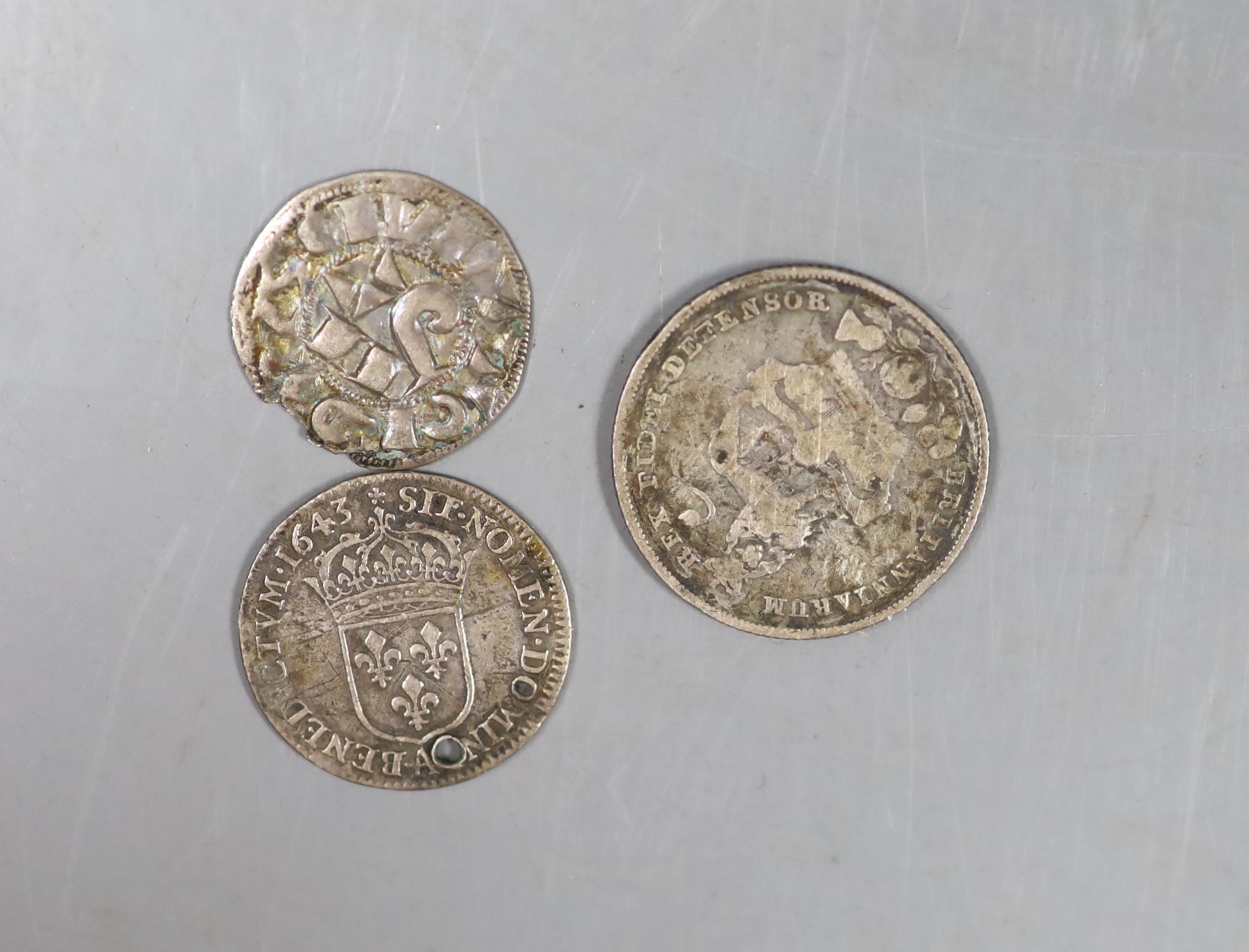 A Louis XIII 1643 five sols and a George IV shilling and a medieval coin